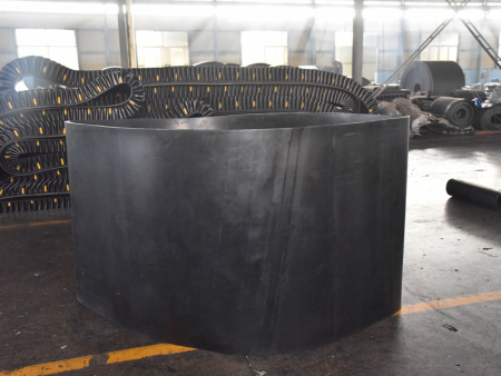How do conveyor belt manufacturers calculate and adjust conveyor belt tension?