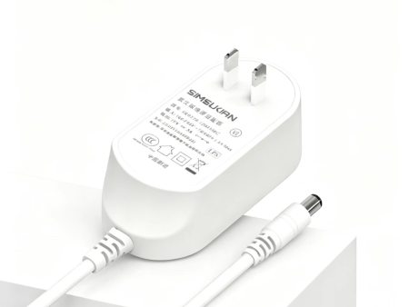 Analysis of Temperature Rise, Heat Dissipation and Housing Material Selection for Wall-Plug Power Adapters